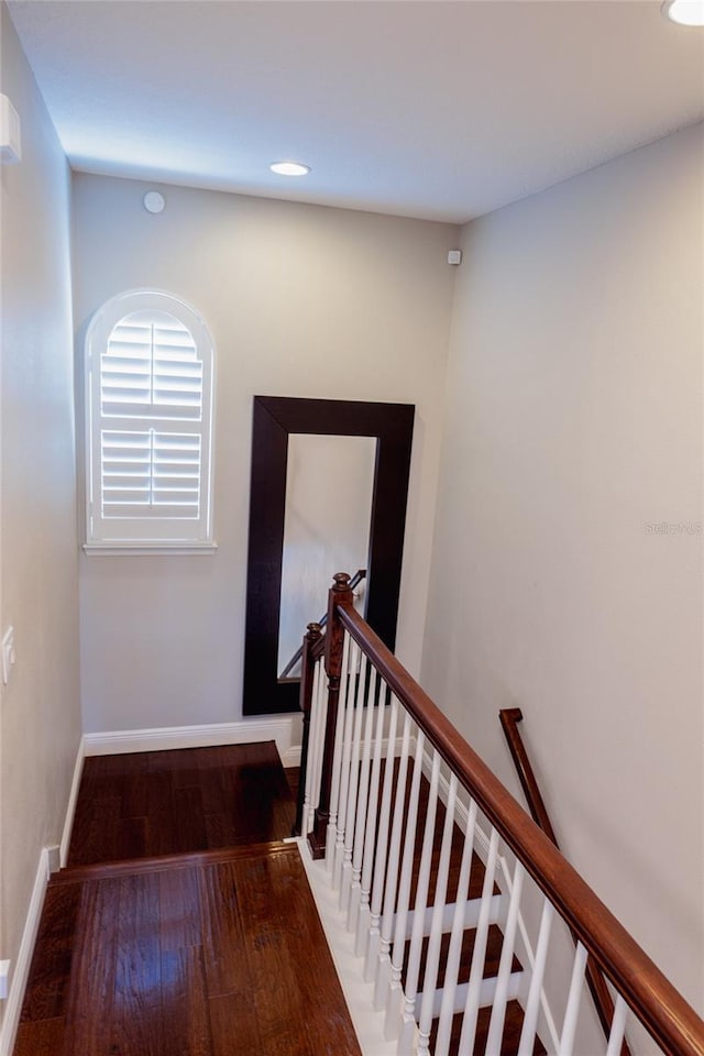 hallway with wood-type flooring