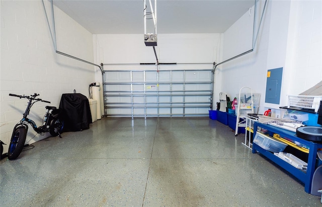 garage featuring electric panel and a garage door opener