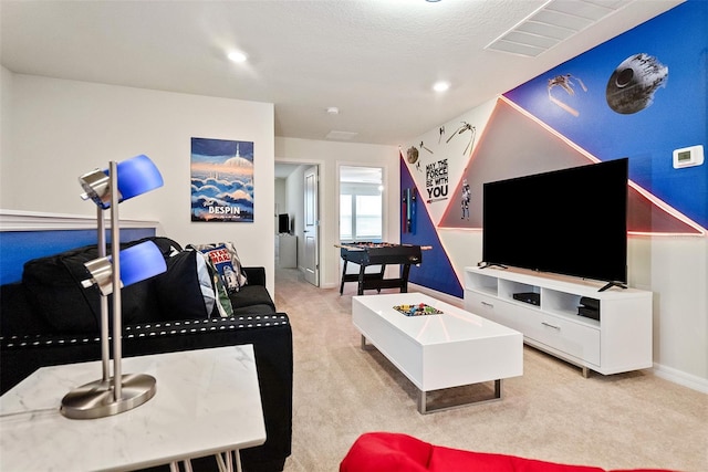 living room with a textured ceiling and light colored carpet