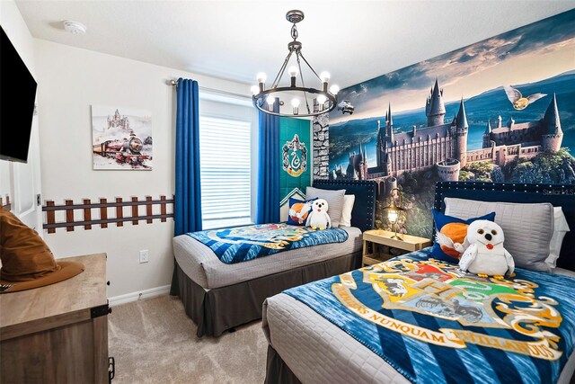 carpeted bedroom with a notable chandelier