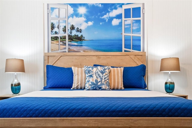 bedroom featuring a water view