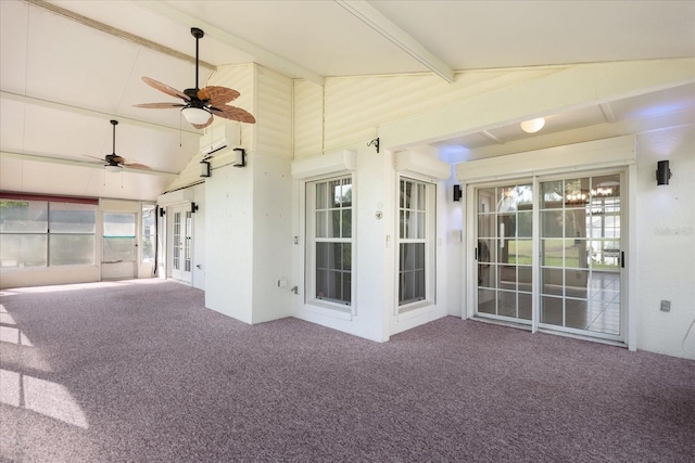 unfurnished sunroom featuring a ceiling fan and lofted ceiling with beams