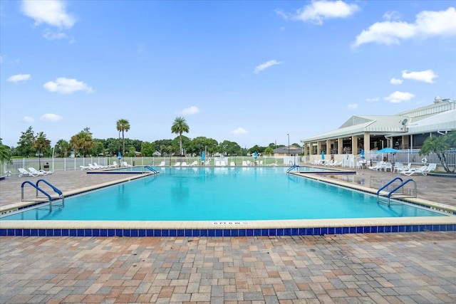 view of swimming pool featuring a patio