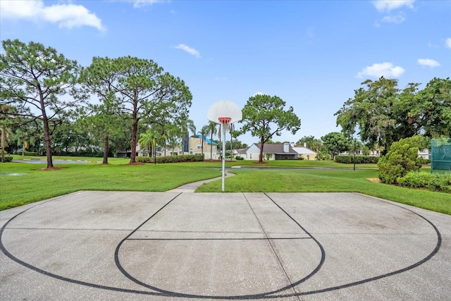 view of basketball court featuring a lawn