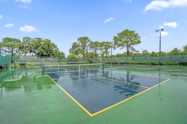 view of sport court with fence