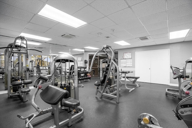 workout area featuring a paneled ceiling