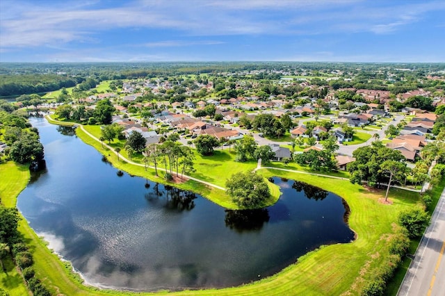 birds eye view of property with a water view and a residential view