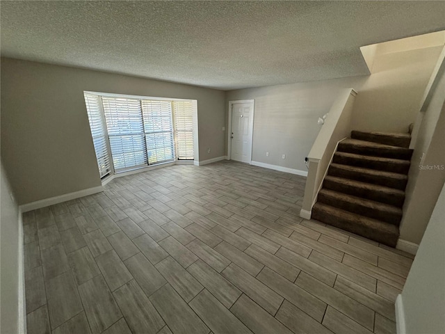 empty room with a textured ceiling