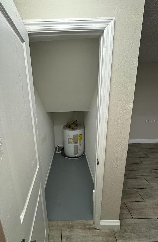 utility room with water heater