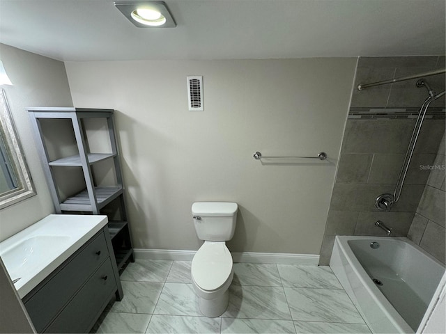 full bathroom featuring vanity, tiled shower / bath combo, and toilet