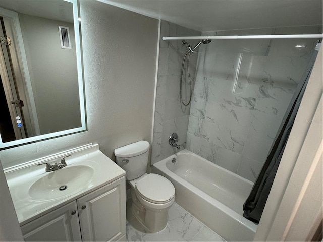 full bathroom featuring toilet, vanity, and tiled shower / bath combo