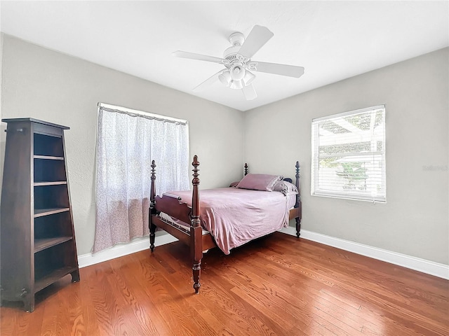 bedroom featuring ceiling fan and hardwood / wood-style flooring