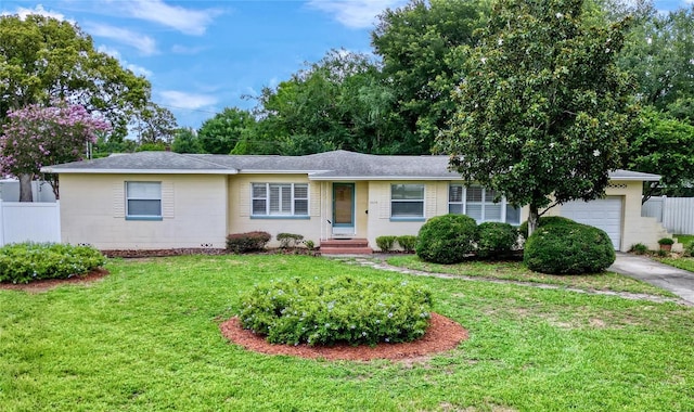 single story home featuring a front lawn