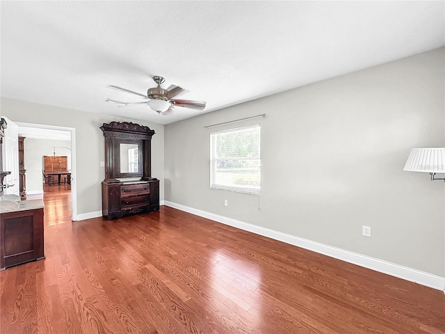 interior space with ceiling fan and hardwood / wood-style flooring