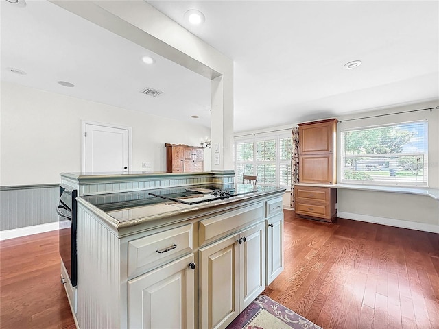 kitchen with tile countertops and hardwood / wood-style floors