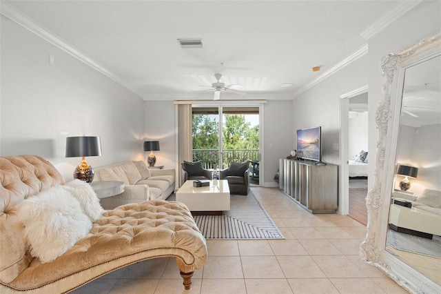 living room featuring light tile patterned floors, ceiling fan, and ornamental molding