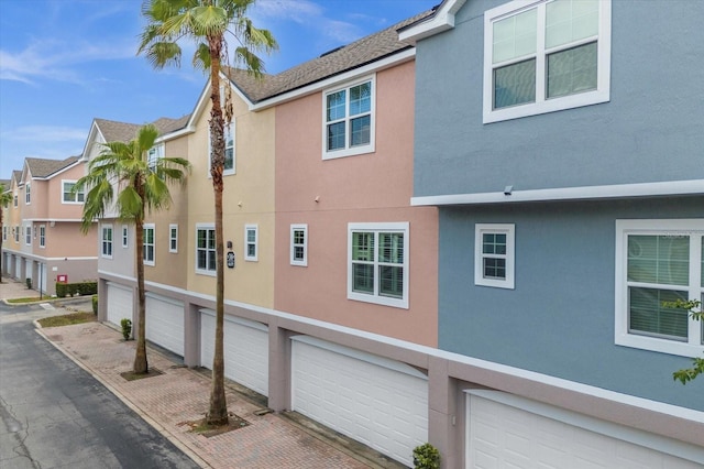 view of side of property with a garage