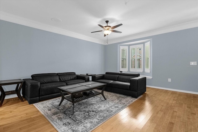 living room with hardwood / wood-style floors, ceiling fan, and ornamental molding