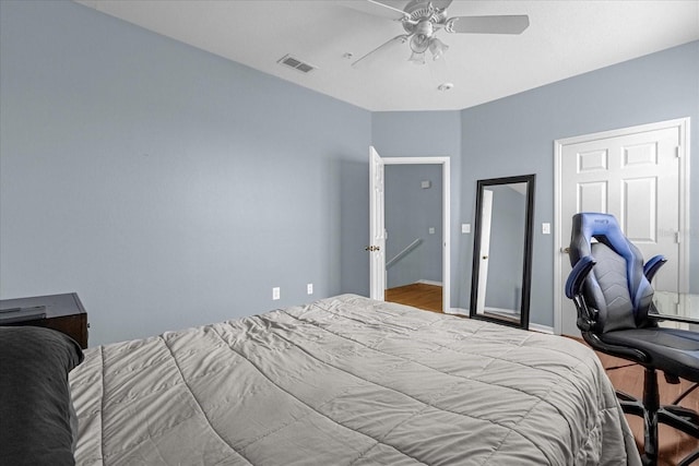 bedroom with light wood-type flooring and ceiling fan