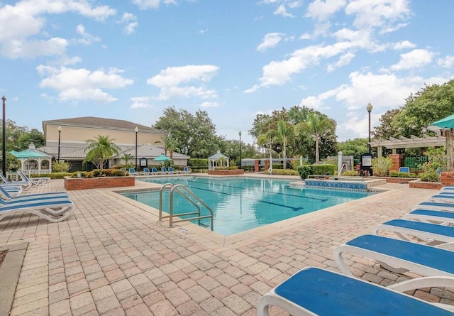 view of swimming pool featuring a patio