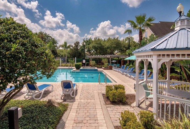 view of pool featuring a gazebo and a patio