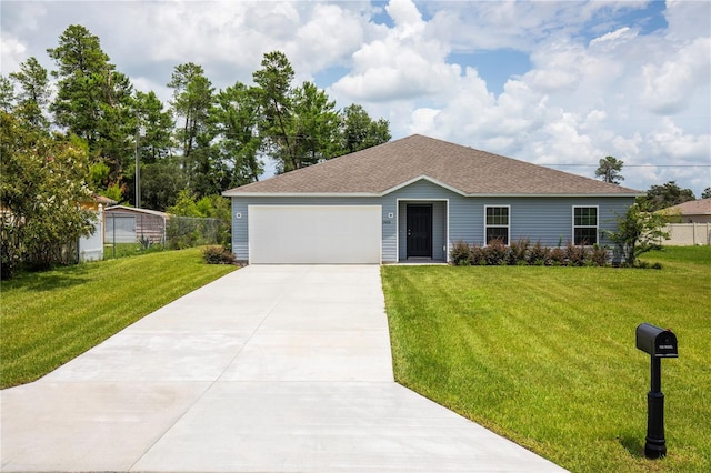 ranch-style house featuring a garage and a front lawn