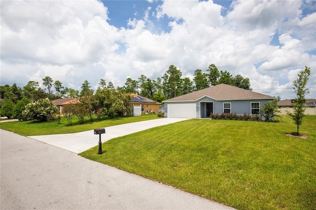 single story home featuring a garage and a front yard