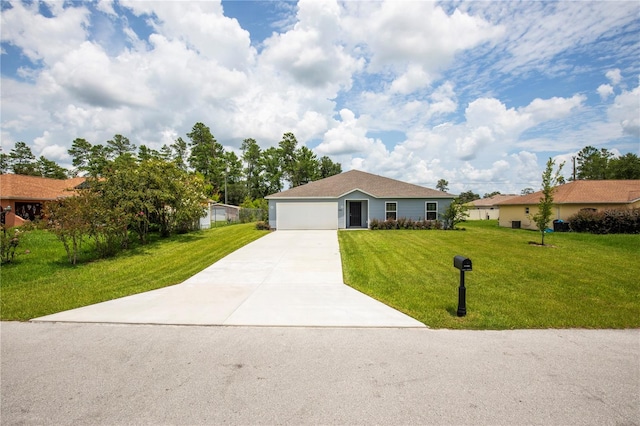 ranch-style house featuring a front lawn and a garage