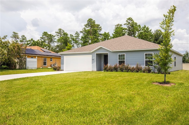 ranch-style house with a garage and a front yard