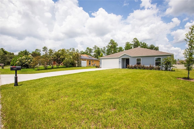 ranch-style house featuring a front lawn and a garage