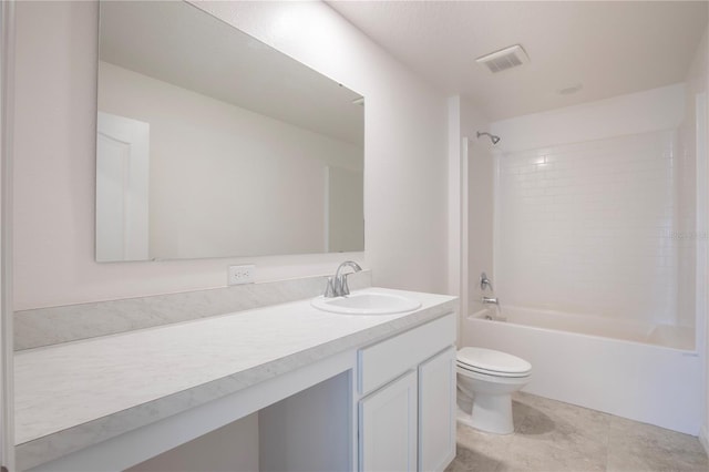 full bathroom with toilet, vanity, and tiled shower / bath