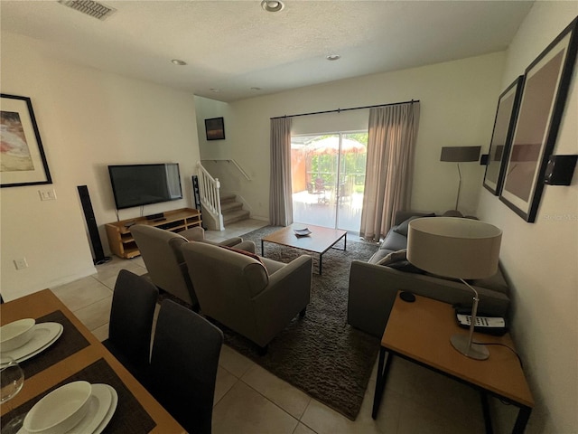 living room featuring light tile floors