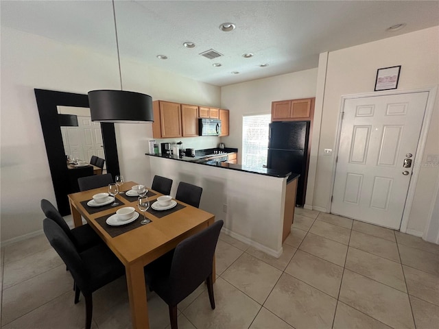 view of tiled dining space