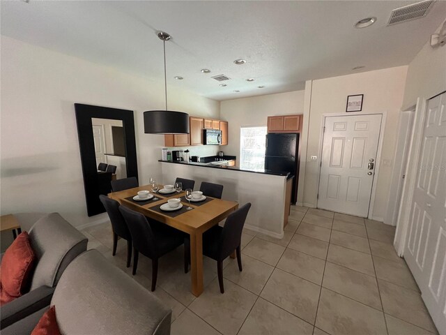 dining area with light tile flooring