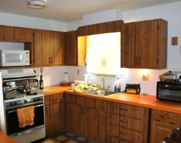 kitchen with stove and sink