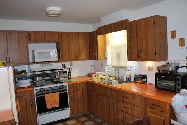 kitchen with white appliances and sink