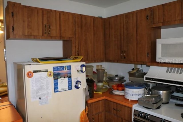 kitchen with refrigerator and stove