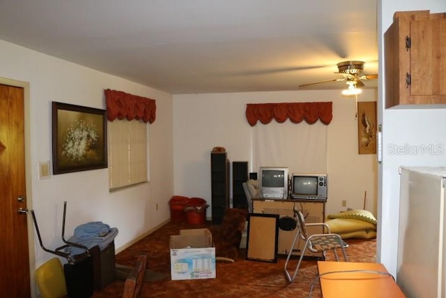 kitchen featuring ceiling fan and stainless steel fridge