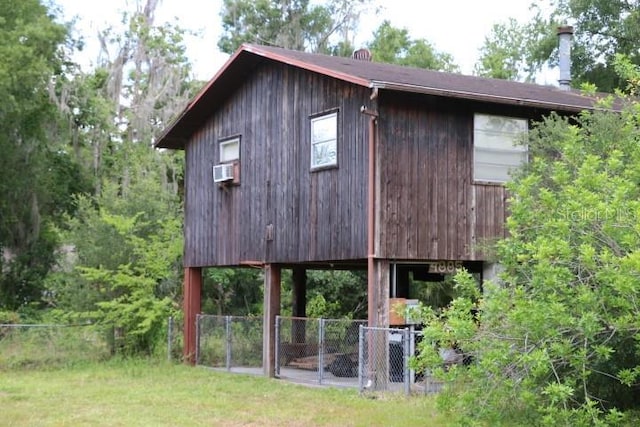 view of outdoor structure featuring a lawn