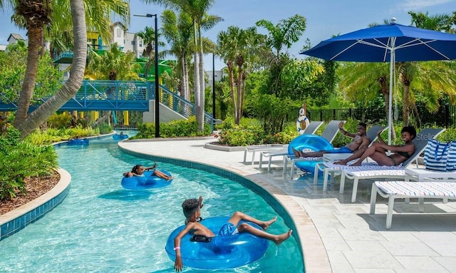 view of swimming pool featuring a patio