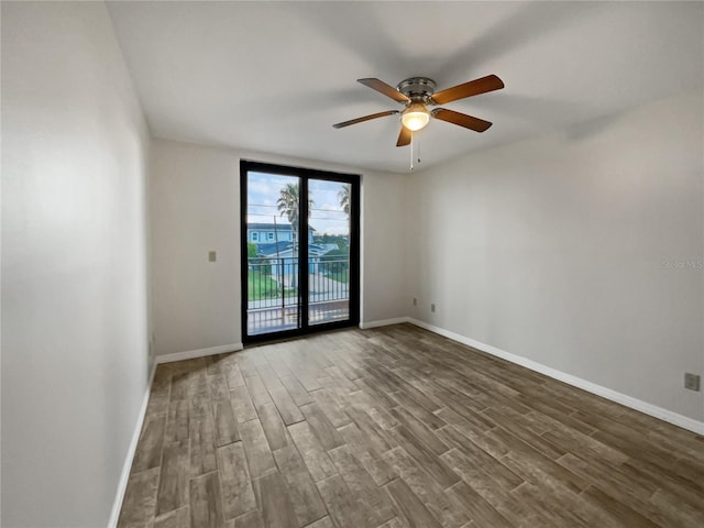 unfurnished room featuring hardwood / wood-style floors and ceiling fan