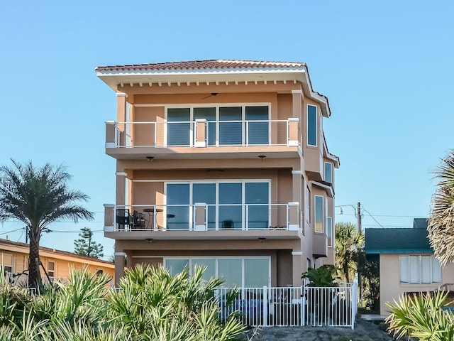 back of house with a balcony