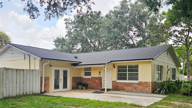 back of house with french doors and a patio area