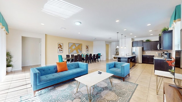 living room featuring light tile patterned floors and recessed lighting