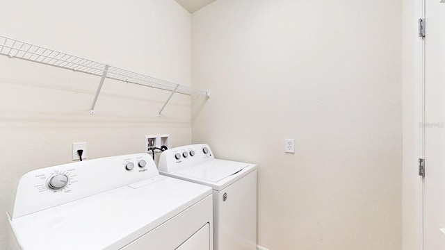 washroom with washing machine and clothes dryer and washer hookup