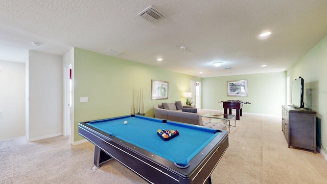 recreation room with light carpet, pool table, and a textured ceiling