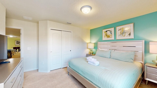 carpeted bedroom featuring a closet