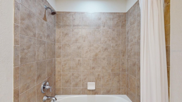 bathroom featuring shower / bath combination with curtain