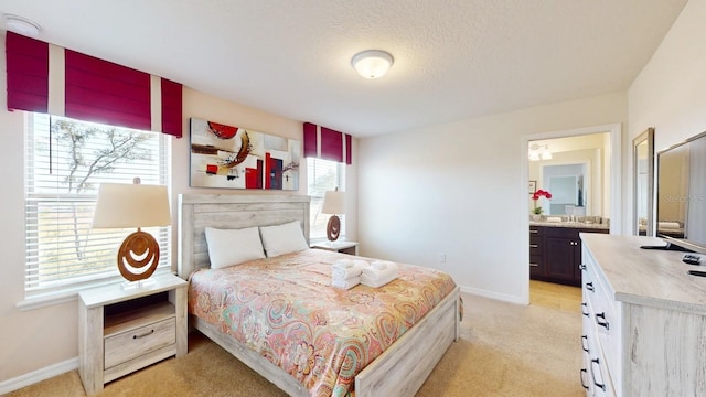 carpeted bedroom featuring connected bathroom