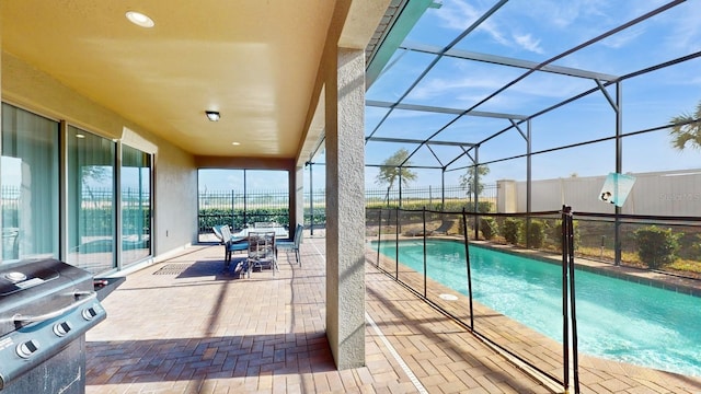 view of pool featuring a patio area and a lanai